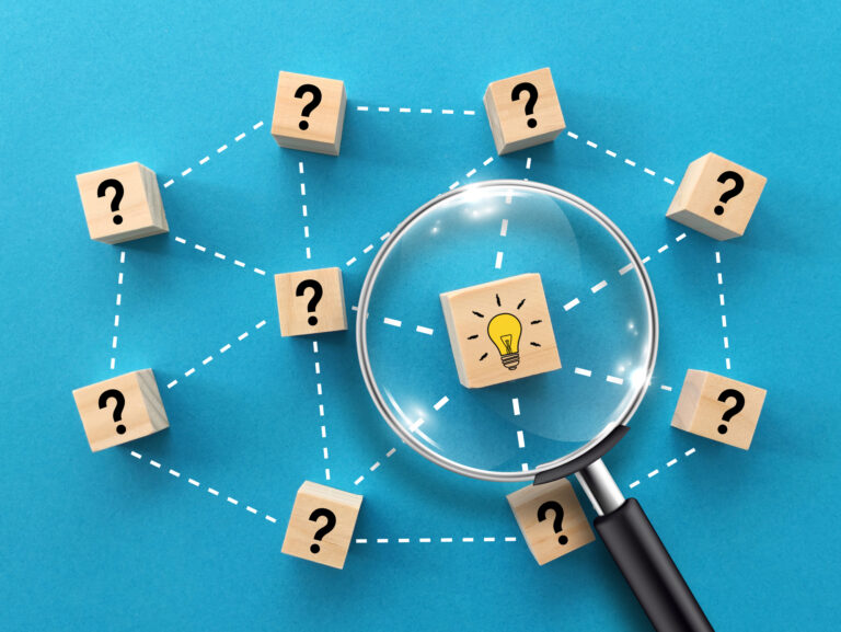 Creative Idea Or Problem Solving Concept, Magnifying Glass And Light Bulb Icons On Wooden Blocks With Blue Background