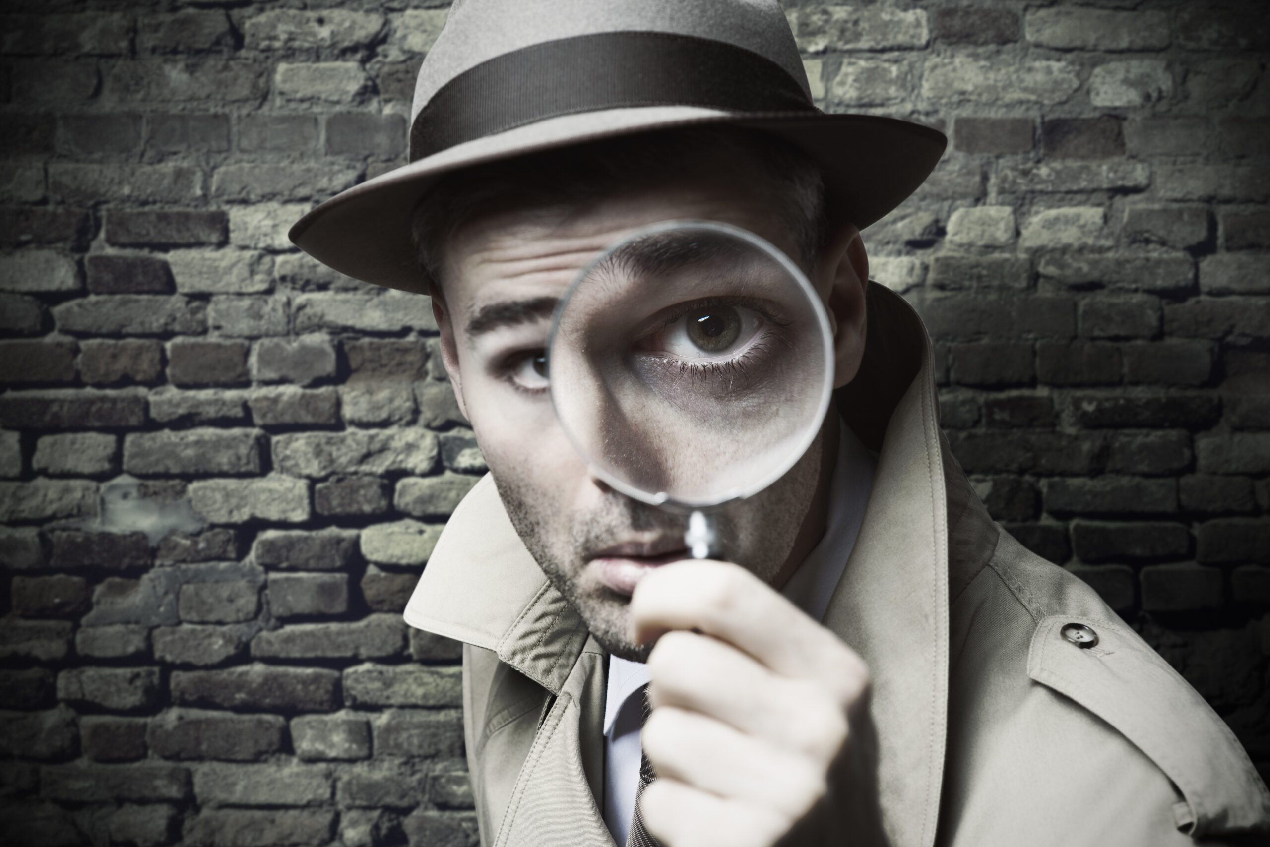 Vintage Detective Looking Through A Magnifier
