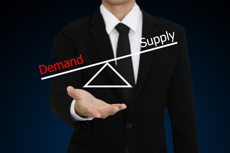 Businessman With Open Hand Gesture Presenting Demand Supply Diag